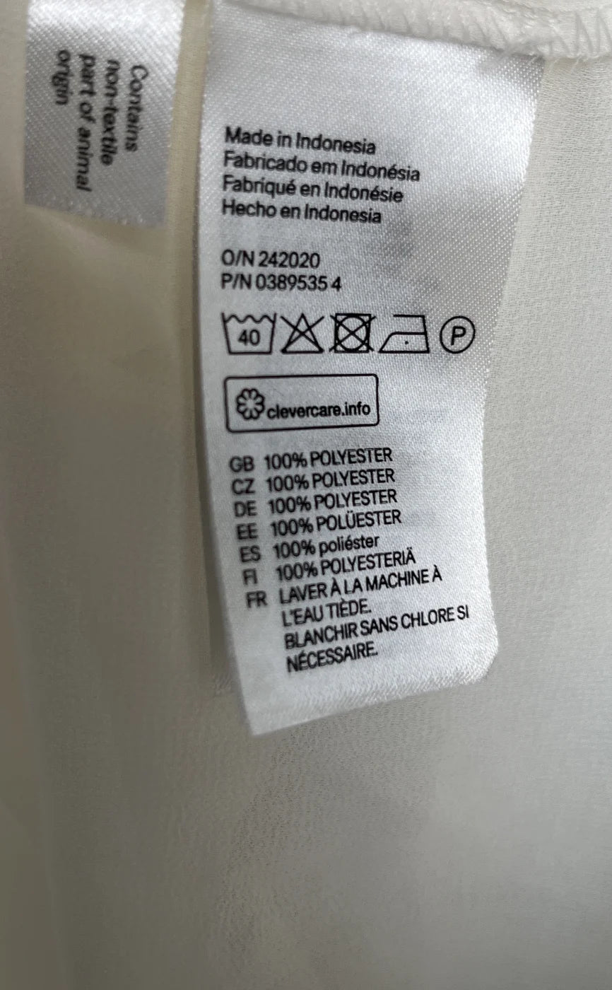 H&M ärmlös genomskinlig blus med knappar