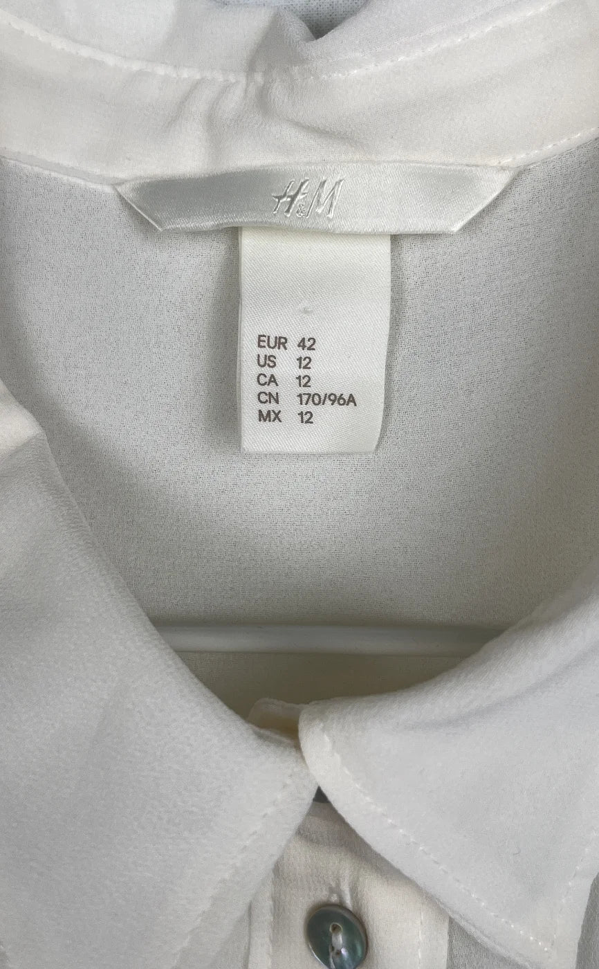 H&M ärmlös genomskinlig blus med knappar